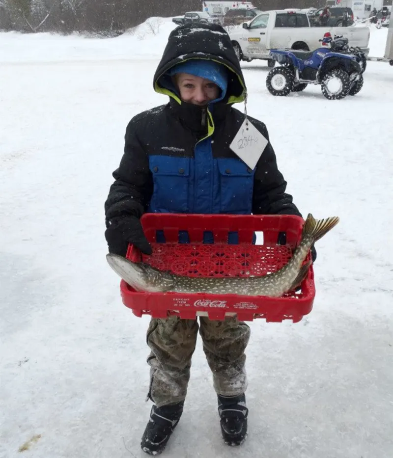 Nothing but smiles behind a warm waterproof outer layer (with a good size pike to boot). Jim Lanthier photo