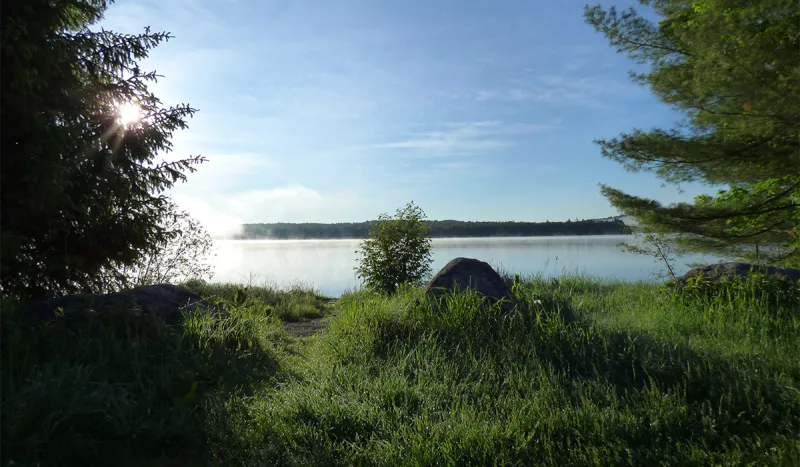 Fog rises off of Horseshoe Lake