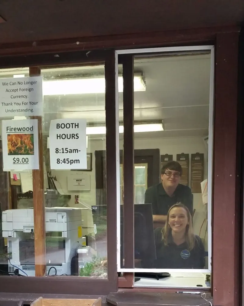 Cheerful staff in the registration booth.