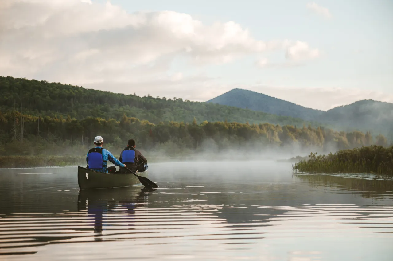 2 people enjoy a spring paddle