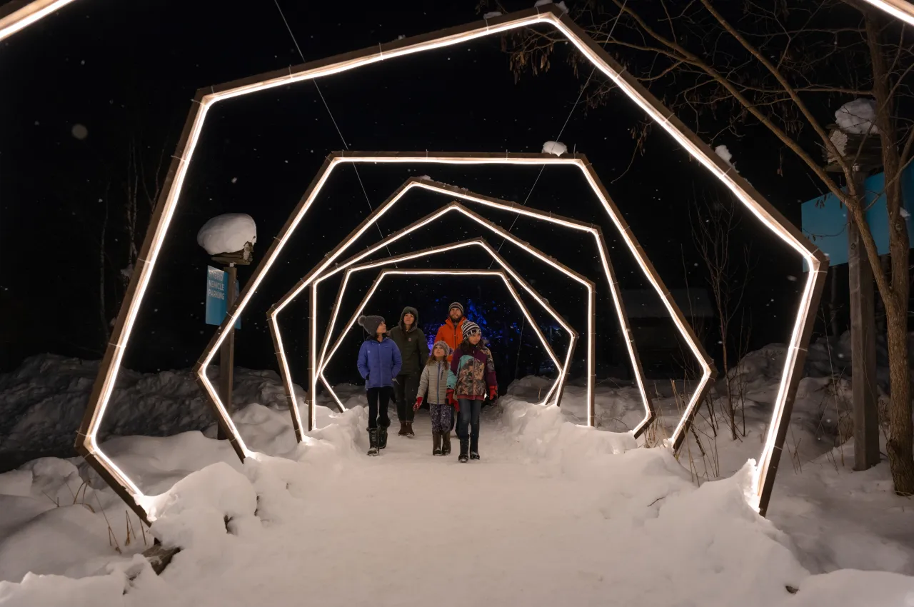 A family enjoying Wild Lights.