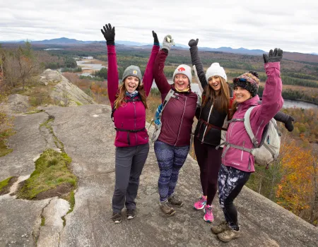 A joyous group celebrates their summit of Lows Overlook.