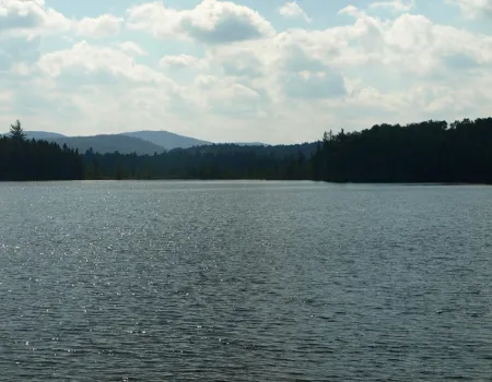 A medium-sized pond with mountain views