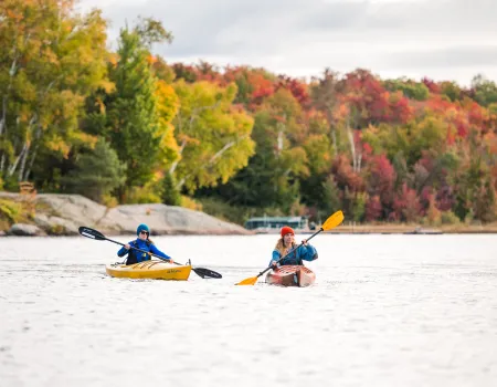 A couple kayakers in the fall