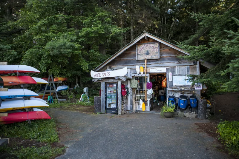 The wooden front of a canoe outfitter