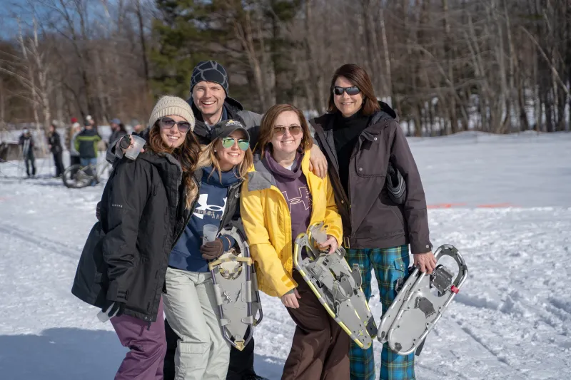 People stand and pose for a photo at BrewSki