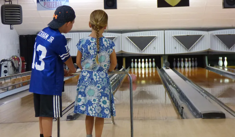 Two kids bowling