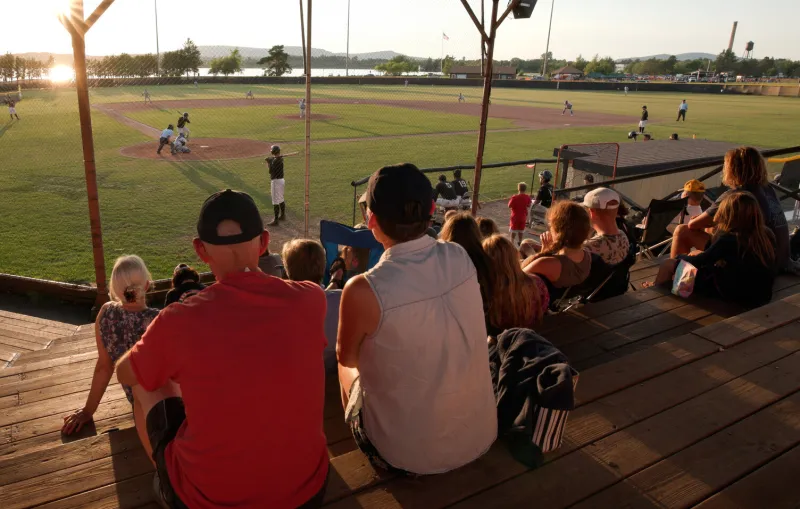 People watch a baseball game