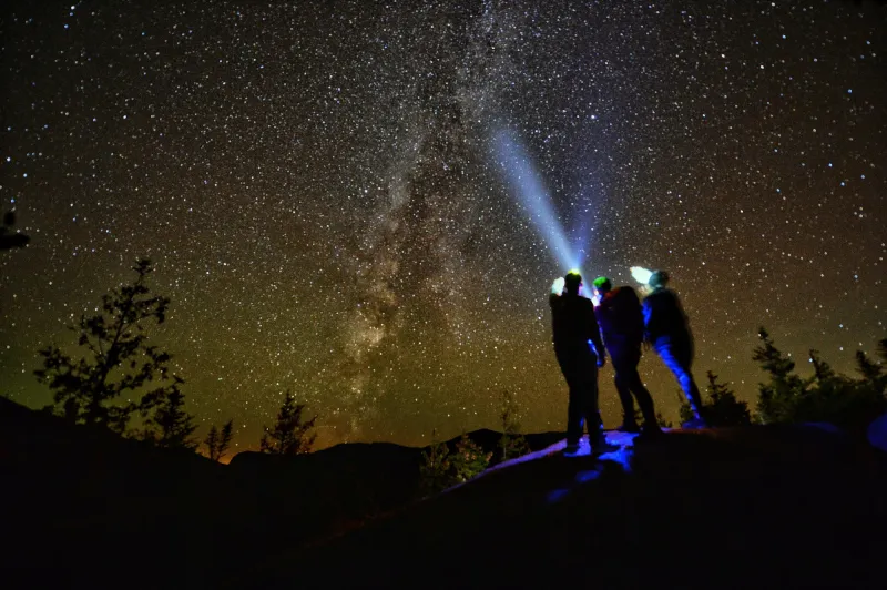 A few people look up at the stars