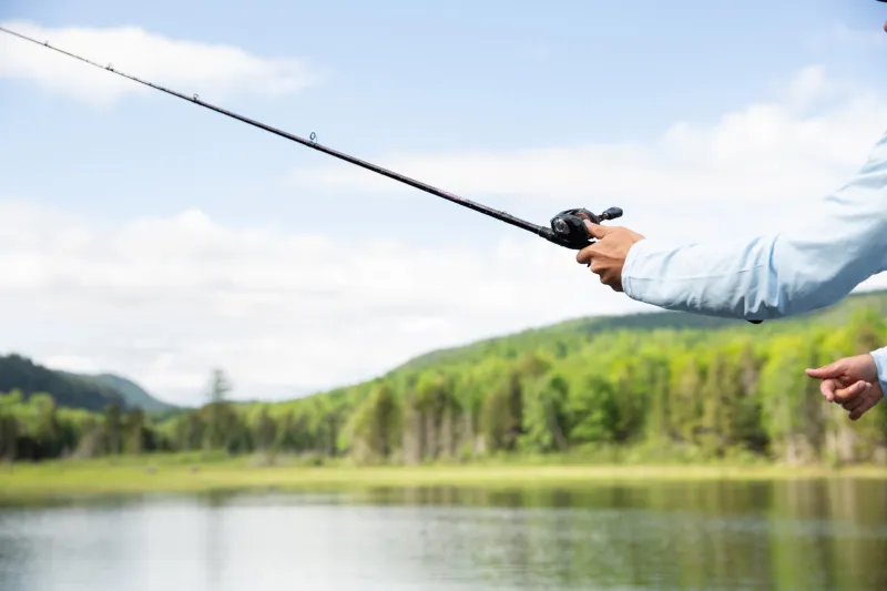 Someone casting a fishing rod