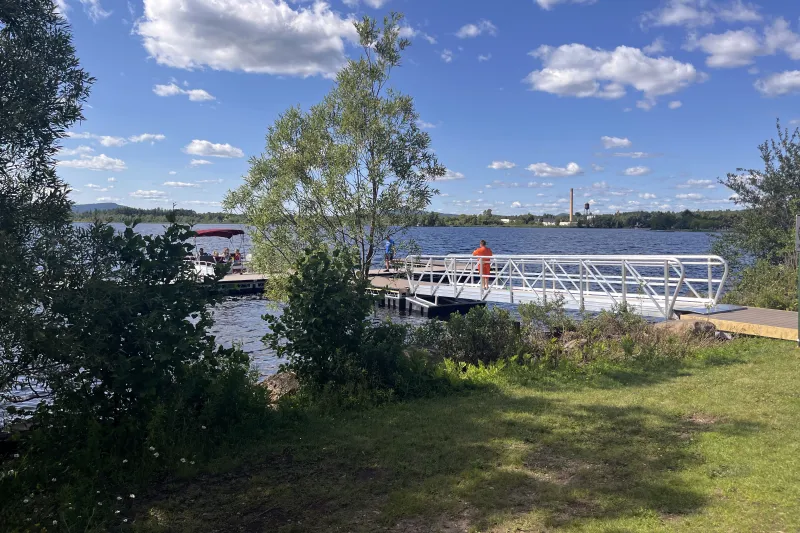 Kid stands on the new docks at Flanders Park in Tupper Lake.