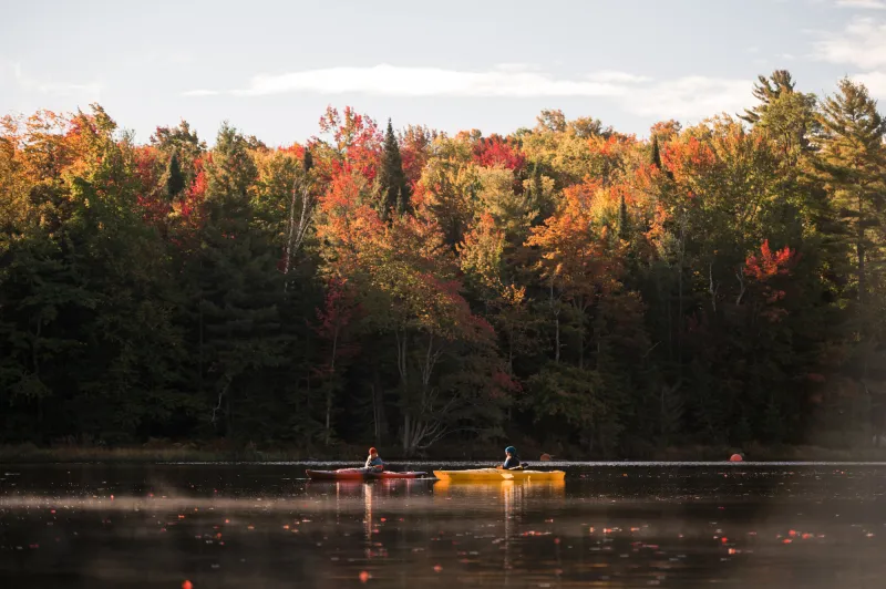 Paddlers on the water in the autumn