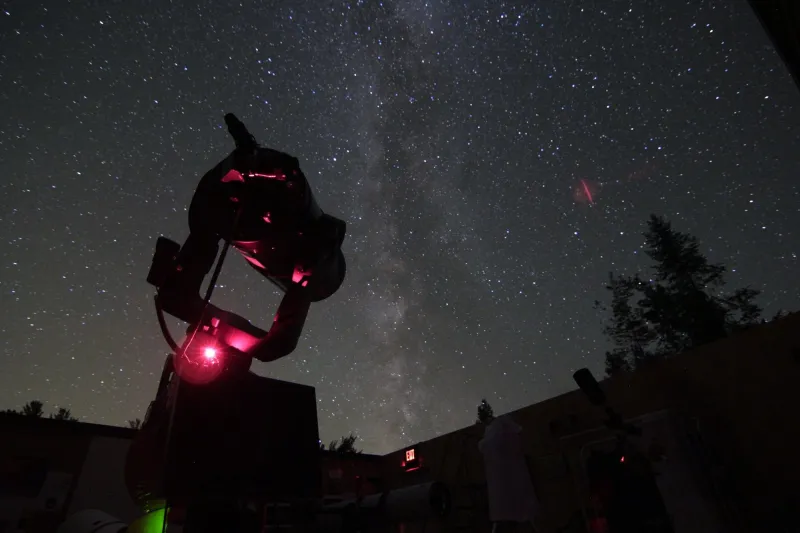 A large telescope pointed towards the sky at night