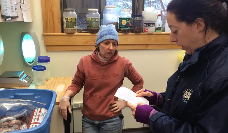 Ruth (left) and Leah (right) review the otter's menu for dinner and breakfast