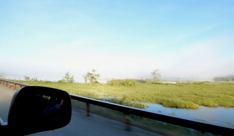 The morning fog rises off Big Tupper Lake as we pass over the causeway between the lake and Simon Pond. (NYS Route 30)