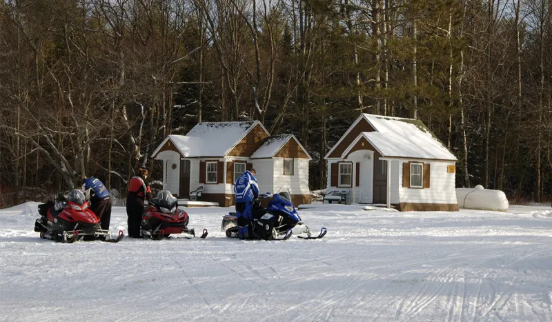 Riders at the Thirsty Moose load their gear onto their sleds in anticipation of another great day of riding (Thirsty Moose photo)