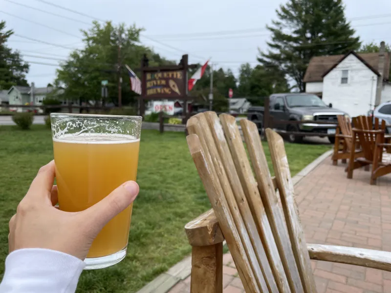 A pint glass with a refreshing beer at Raquette River Brewing.