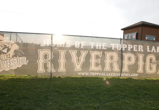 Riverpigs Banner on the side of the field.