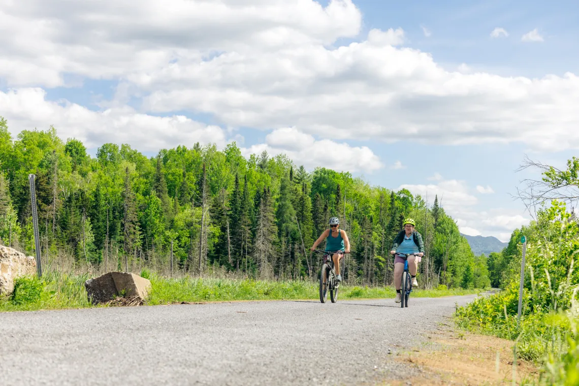 two women bike on a gravel route