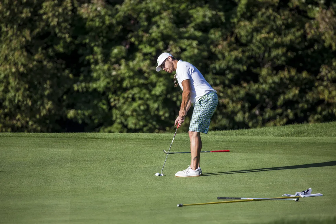 A golfer puts from the green of the Tupper Lake Golf Club