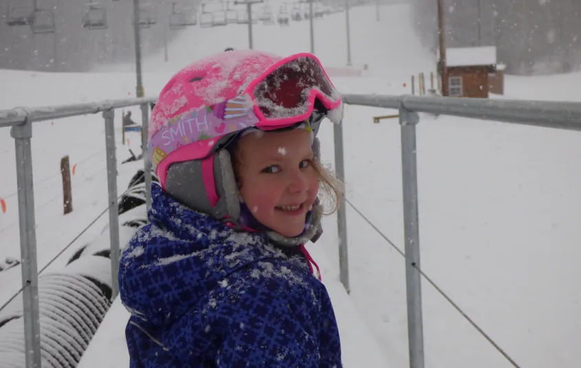 A kid at Titus Mountain on a snowy day.