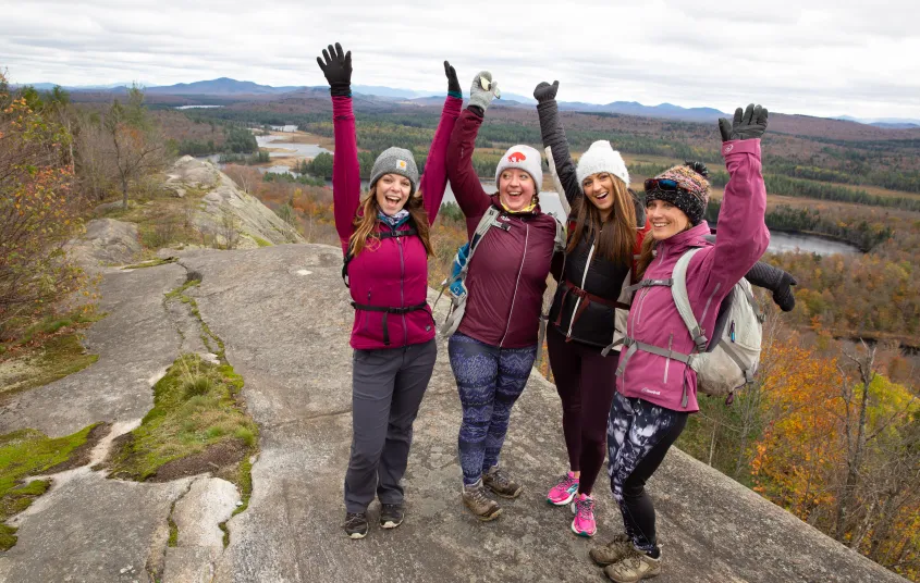 A joyous group celebrates their summit of Lows Overlook.