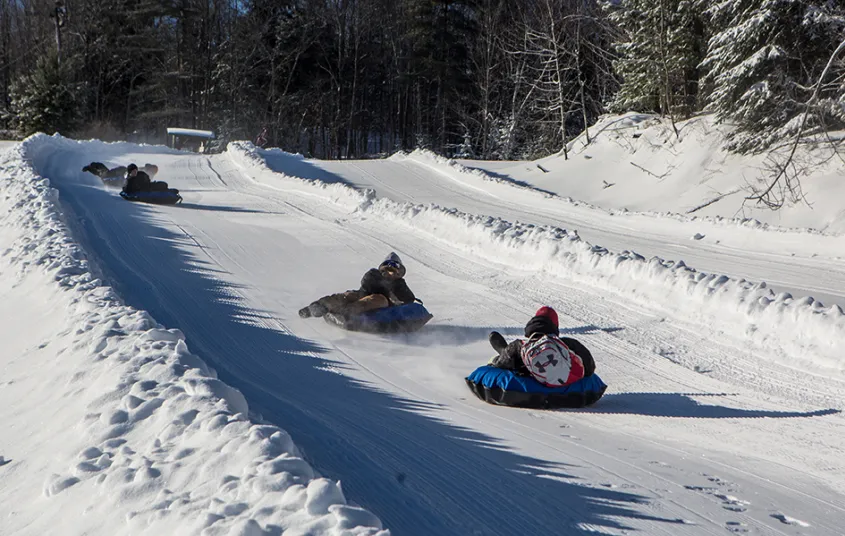 A few people tubing down the Mt Pisgah tubing runs