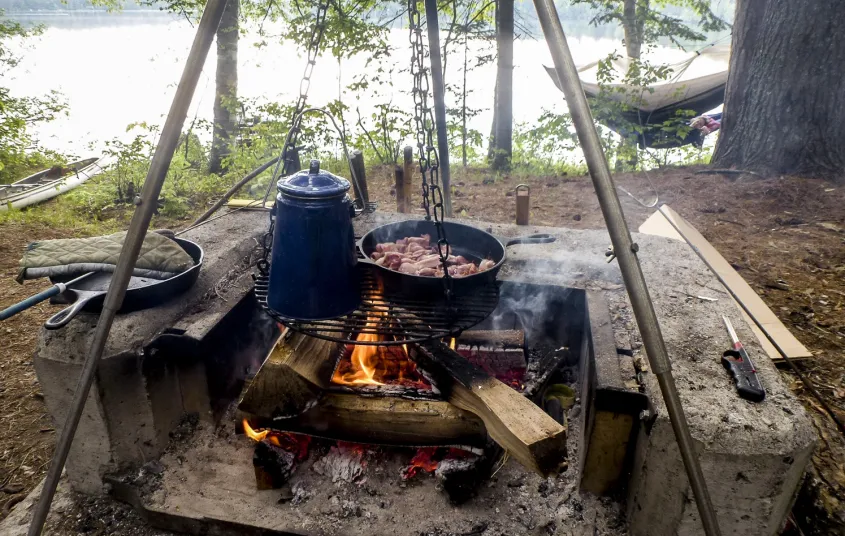 Sling a hammock waterside while the food cooks over the fire pit.