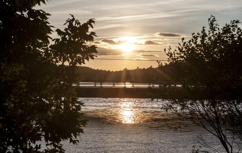 A bridge over a river at sunset