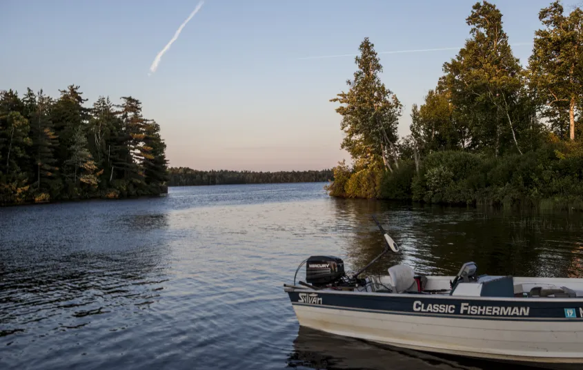 A boat on the shore of an inlet