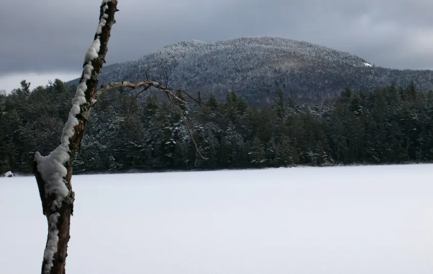 Frozen Stony Creek Ponds with the view of a mountain.