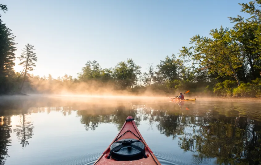 Kayakers in the early morning mist