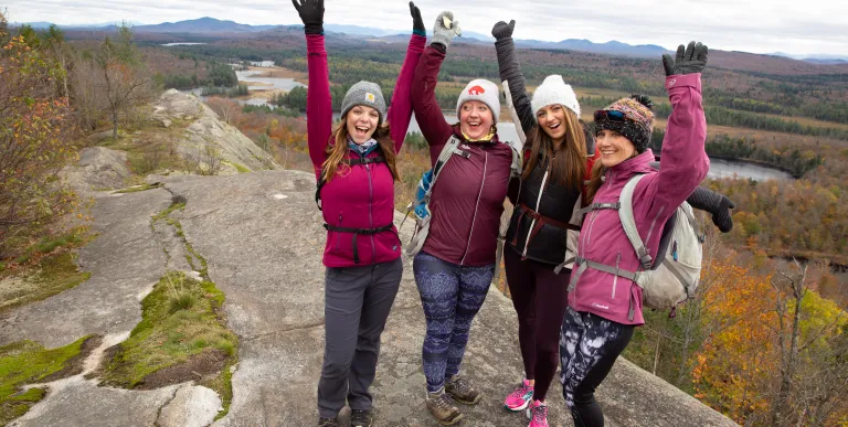 A joyous group celebrates their summit of Lows Overlook.