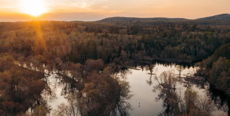 An aerial photo of a winding river during the spring